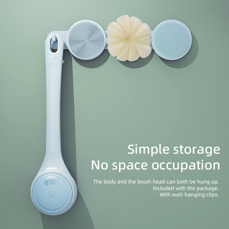 Cleaning brush with interchangeable heads on a green background